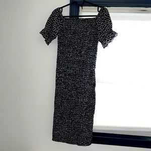 Adorable body con dress with puff sleeves. Never worn.